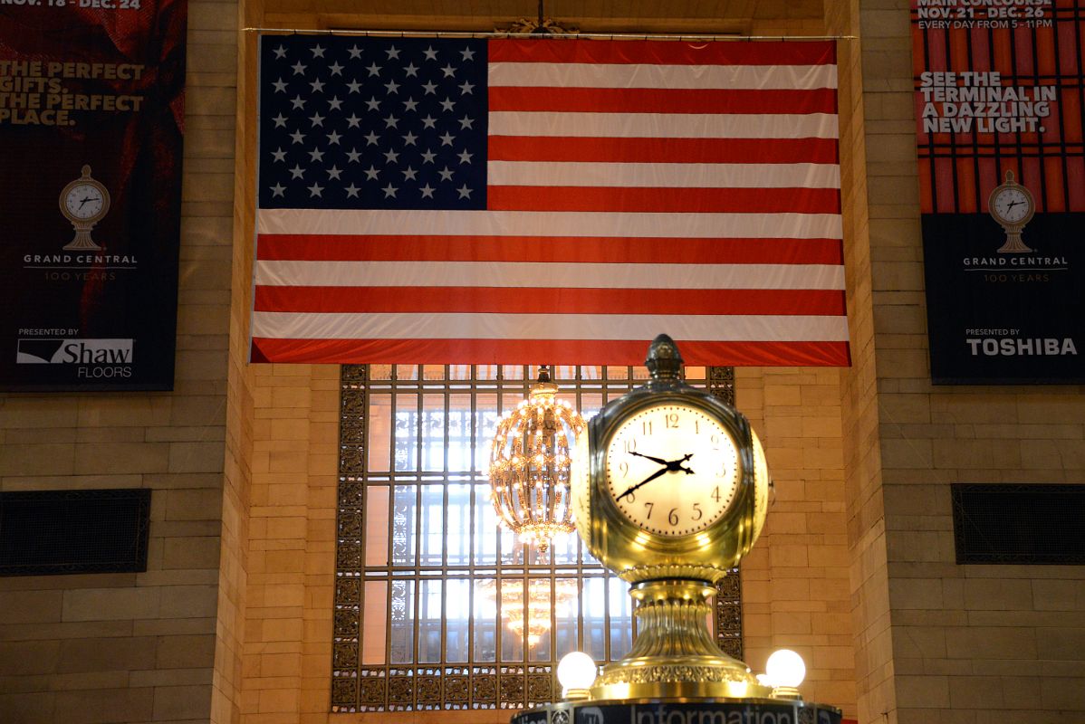 08-2 Clock With American Flag Behind In New York City Grand Central Terminal Main Concourse